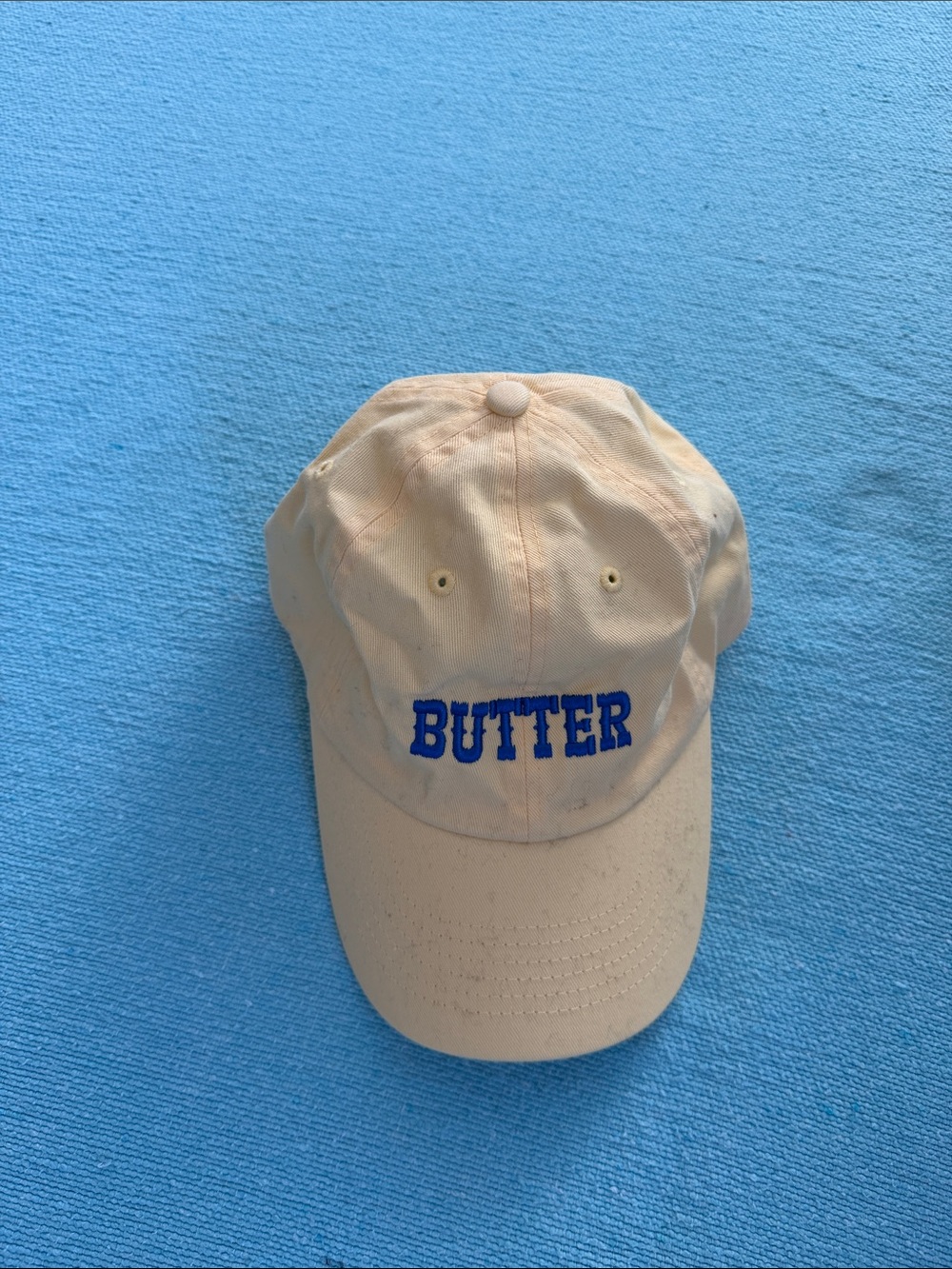 Butter Cream Cap with Blue Embroidered Logo